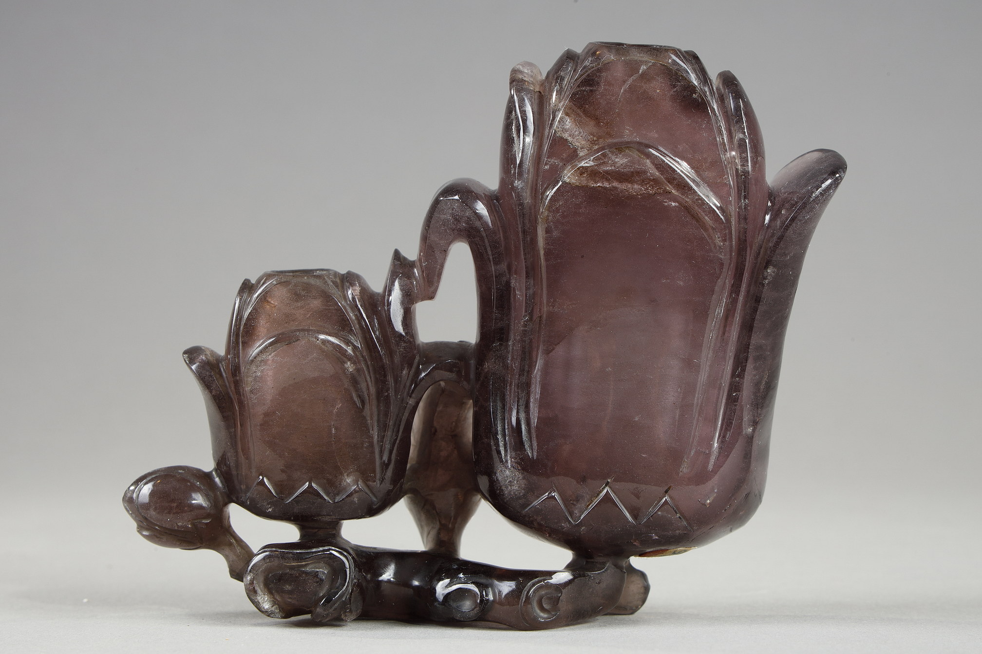 Amethyst group forming double vase depicting two magnolia flowers and branches